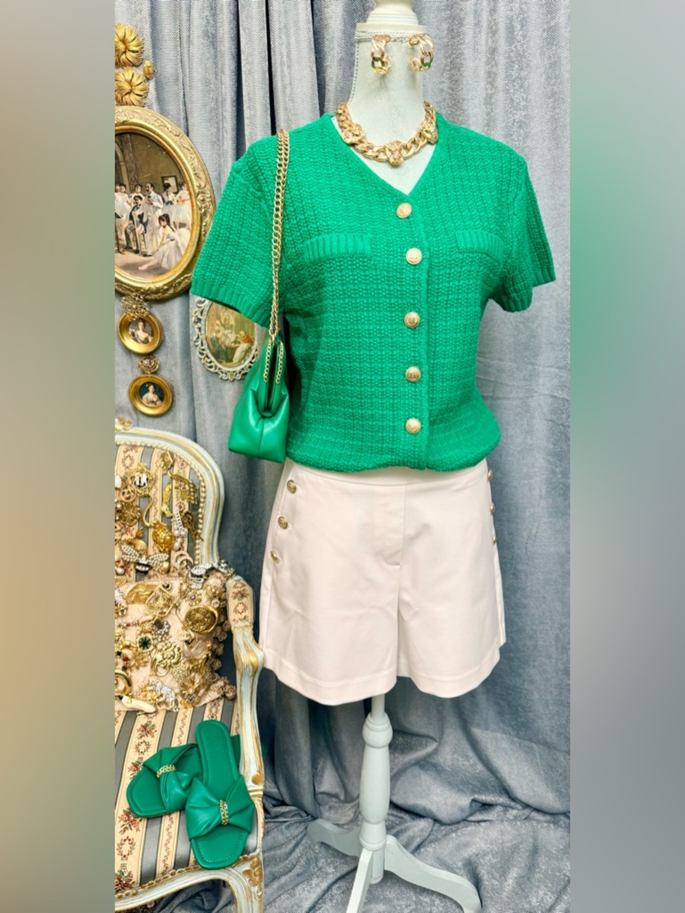 Cream shorts with green sweater blouse